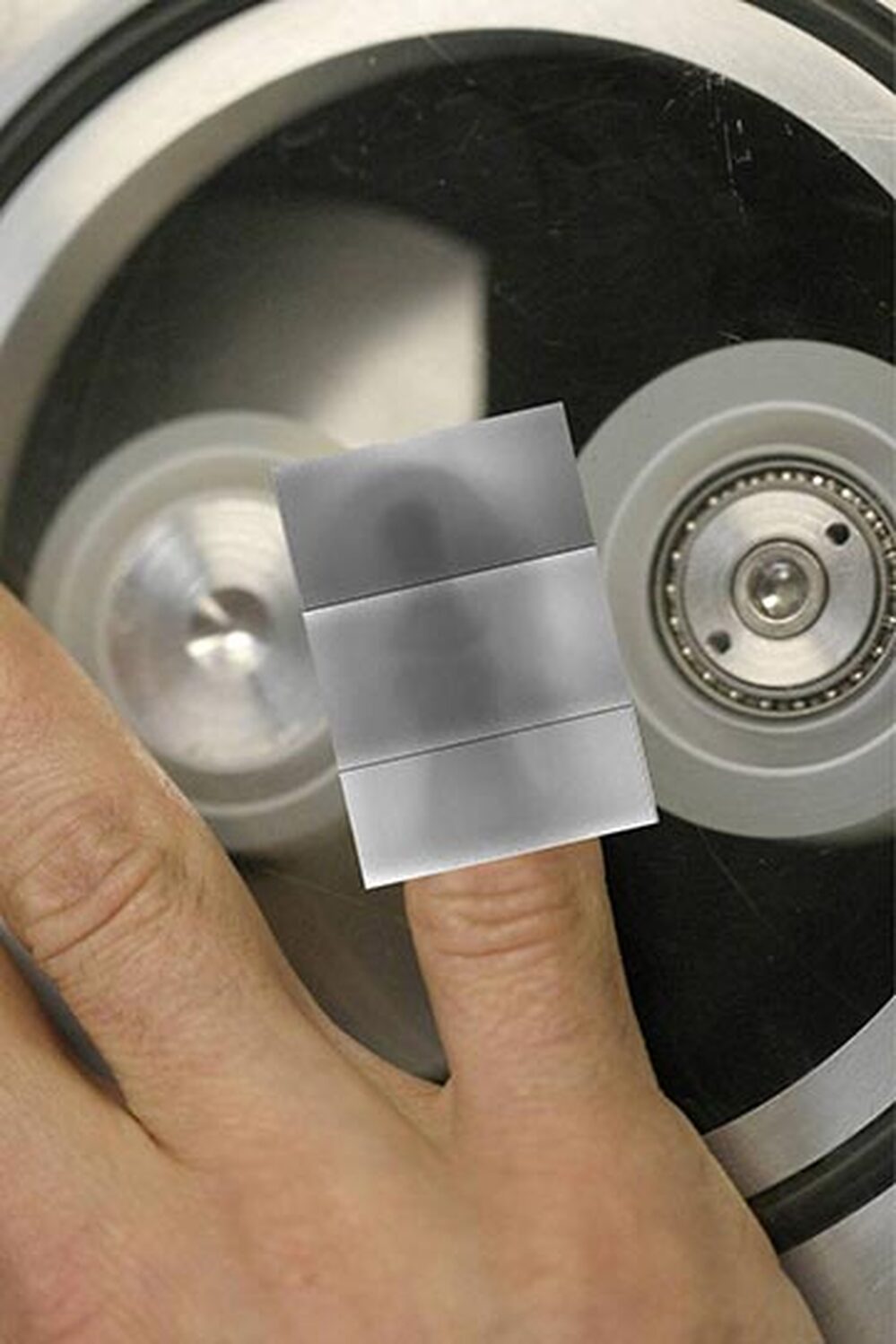 Researchers display an x-ray photograph of a finger generated by peeling sticky tape.