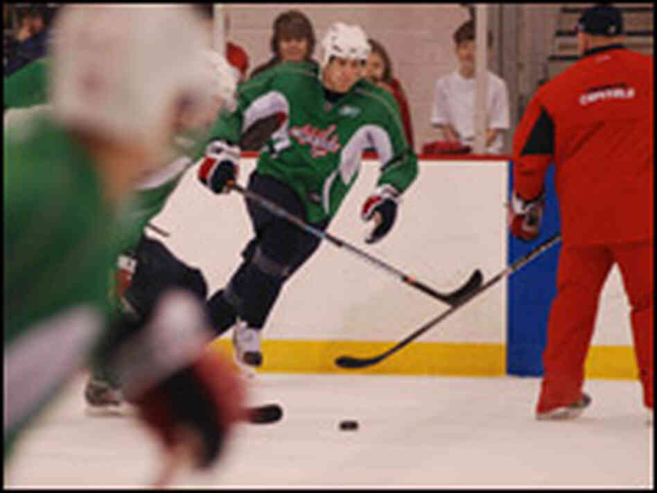 Washington Capitals forward  Brooks Laich focuses on the puck during practice.