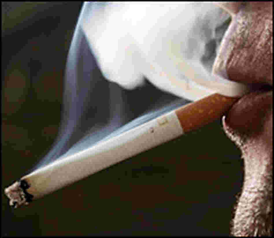 Smoking a cigarette. CREDIT: Owen Humphreys/PA Wire/AP