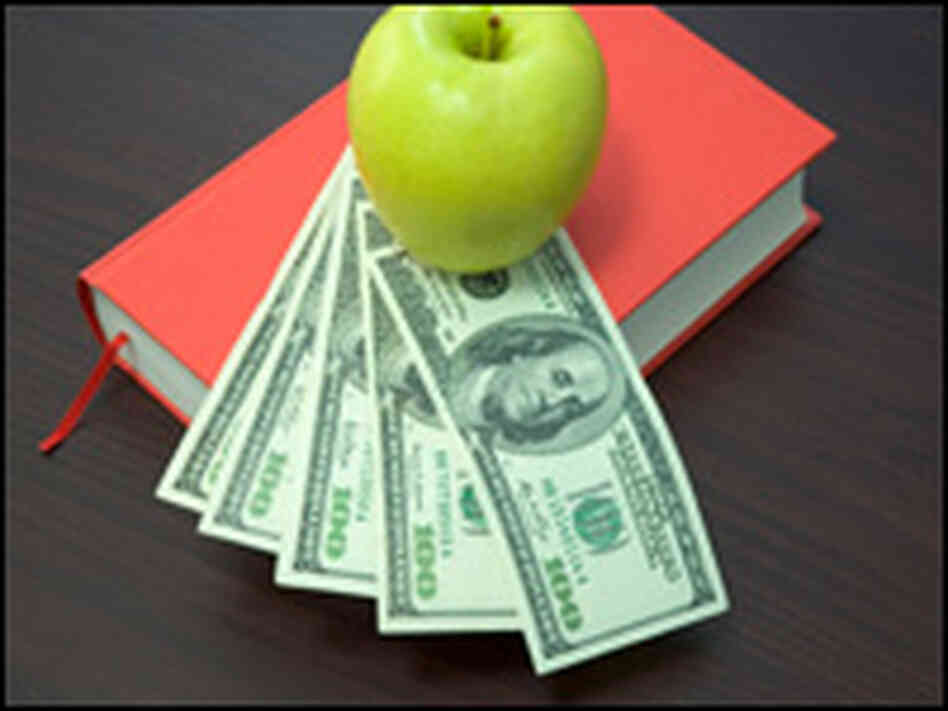 An apple, books and money. An apple, books and money.