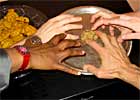 Staff of NPR's <i>Weekend Edition</i> reach for a last cookie.