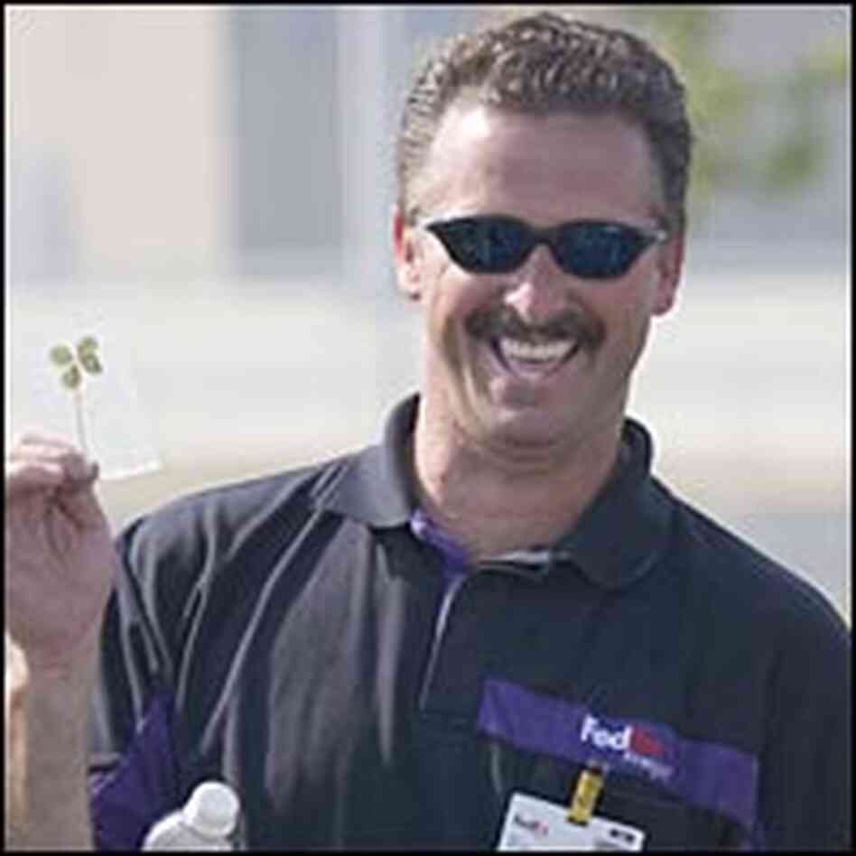 Truck driver Wayne Crowder shows off his lucky clover, kept in a plastic bag. Truck driver Wayne Crowder shows off his lucky clover, kept in a plastic bag.