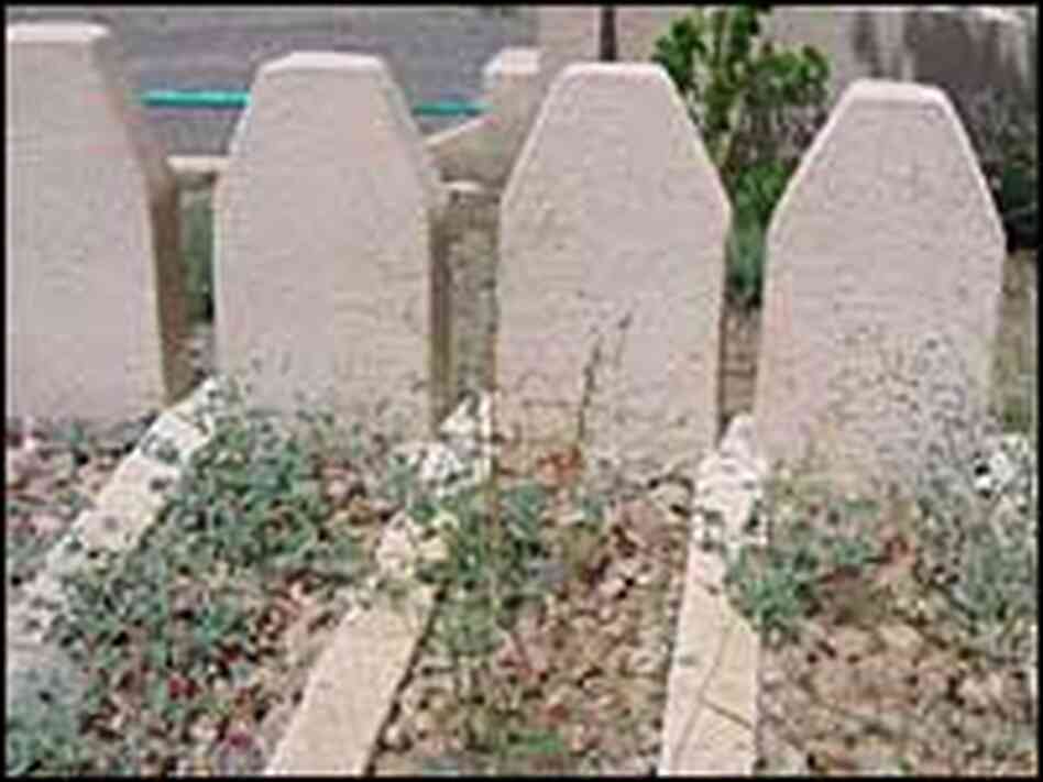 Graves at a remote cemetery memorializing the victims Graves at a remote cemetery memorializing the victims