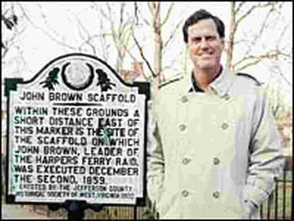 Author David Reynolds stands next to a marker for the scaffold on which Brown was executed. Author David Reynolds stands next to a marker for the scaffold on which Brown was executed.