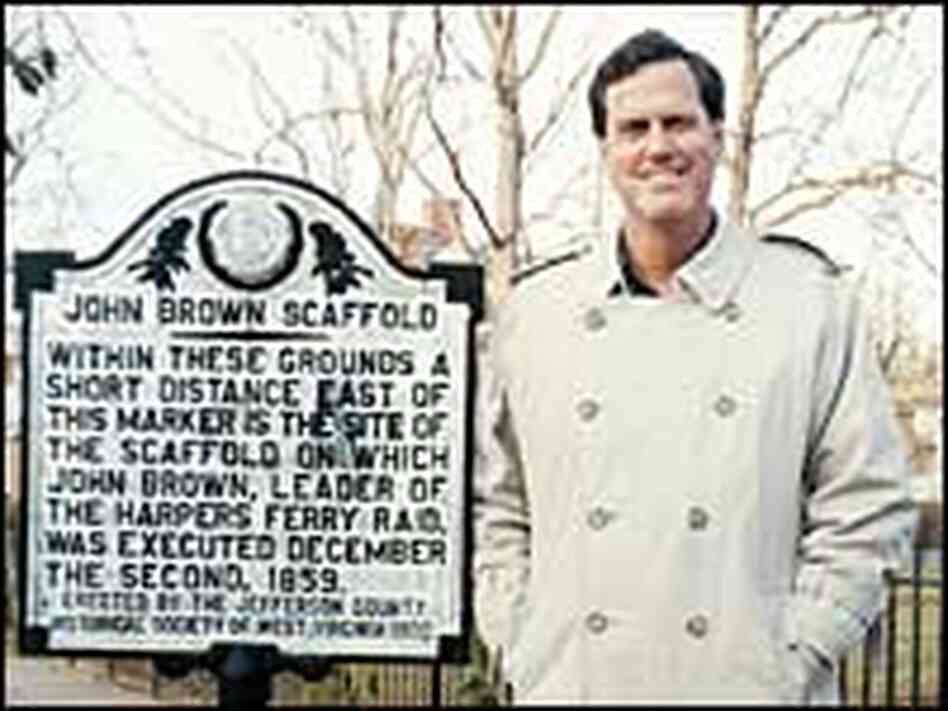 Author David Reynolds stands next to a marker for the scaffold on which Brown was executed. Author David Reynolds stands next to a marker for the scaffold on which Brown was executed.