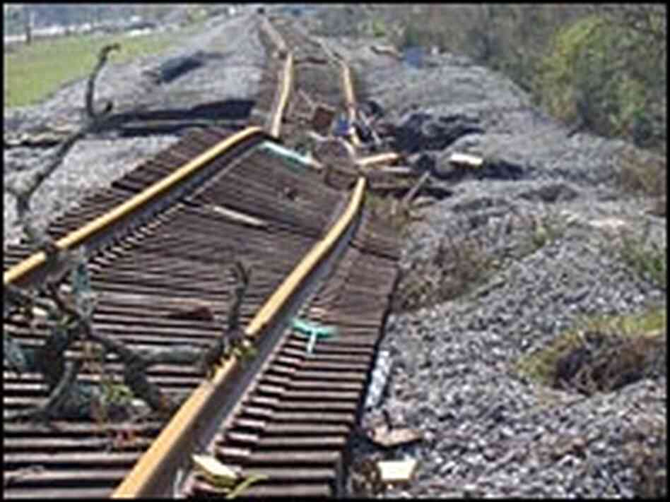 Railroad tracks lie twisted and buckled in Waveland, Miss. Railroad tracks lie twisted and buckled in Waveland, Miss.