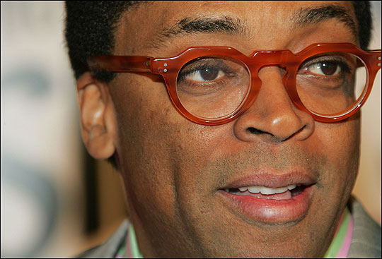 Spike Lee, wearing bright red glasses, photographed in March 2006.