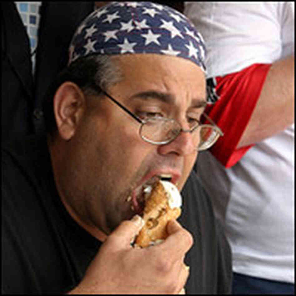 Competitive eater Cookie Jarvis eats a cannoli. Competitive eater Cookie Jarvis eats a cannoli.