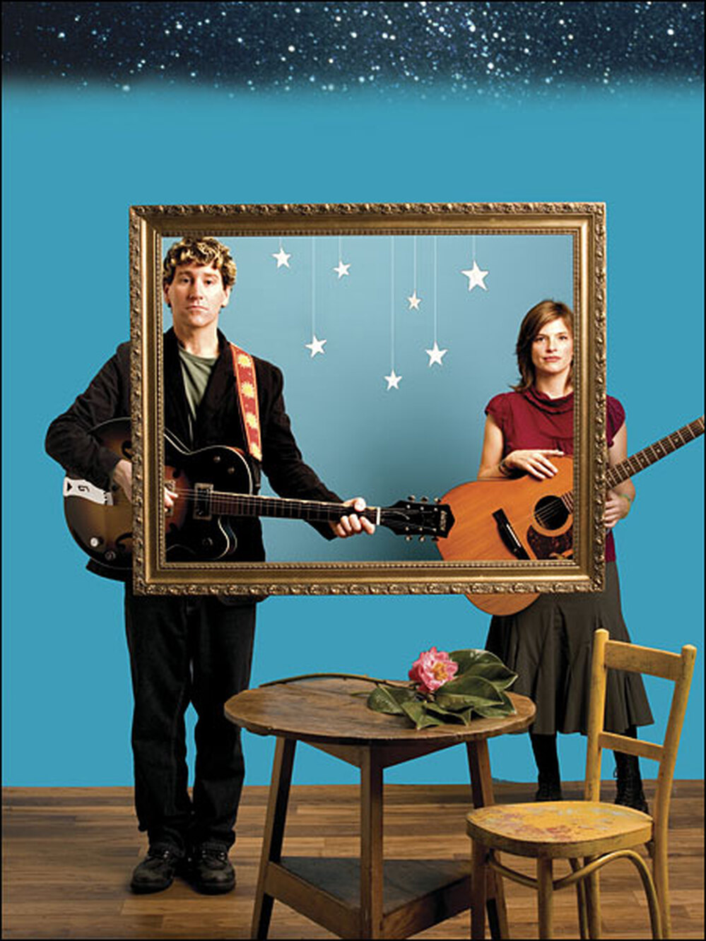 Steve Tannen and Deb Talan stand at the opposite boundaries of a photo frame.