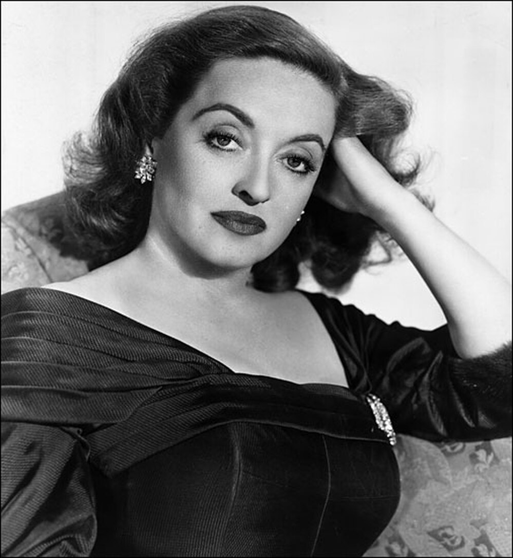 Bette Davis looks provocatively at camera