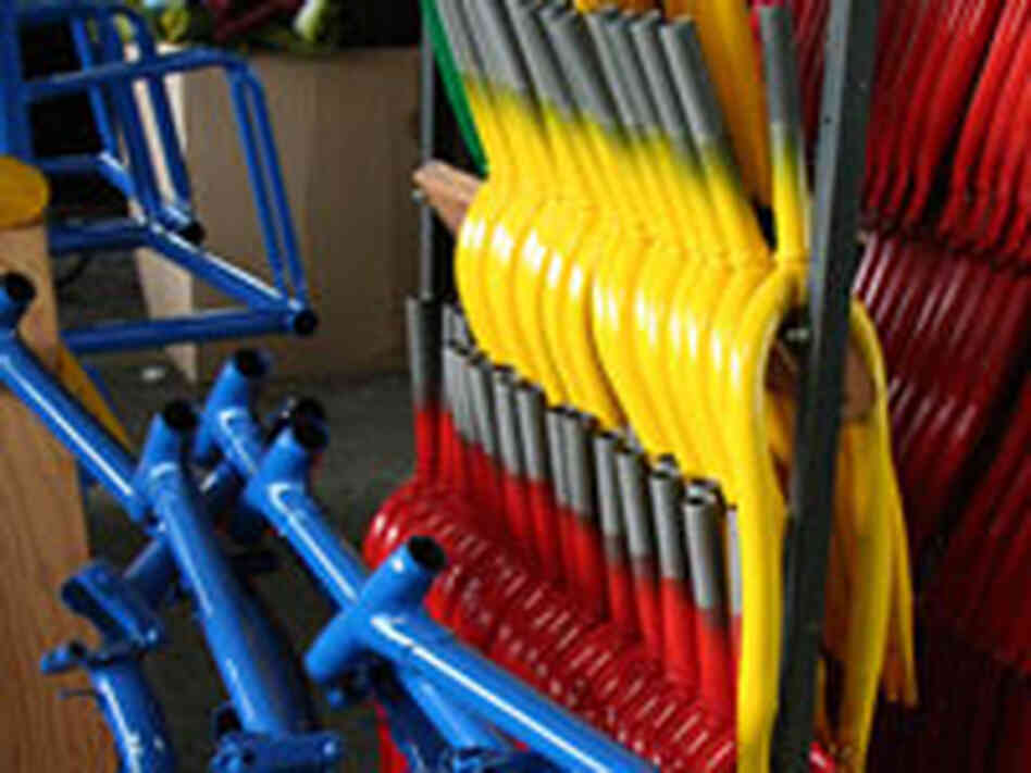 Freshly painted bike frames at Worksman Cycles.