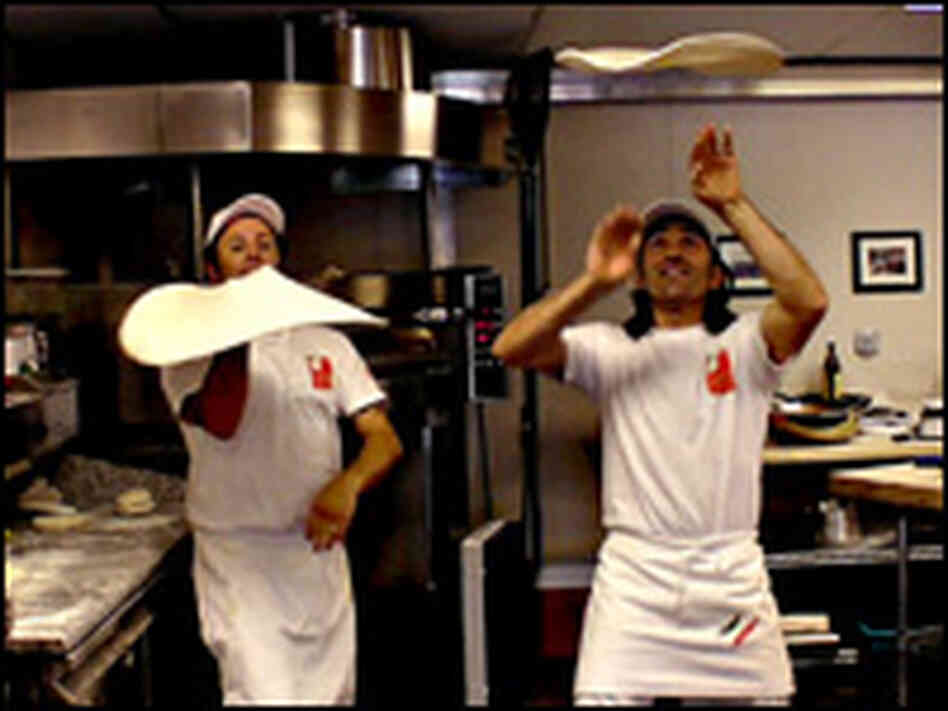 Pizza master Graziano Bertuzzo demonstrates how to toss a pizza.