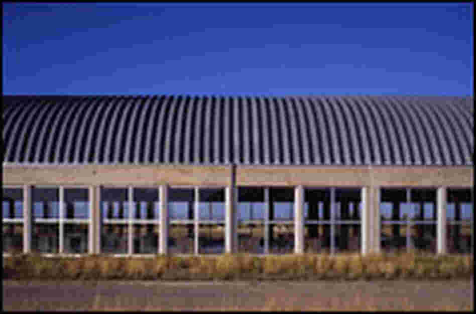 An exterior view of the artillery shed housing Judd's 100 untitled works in mill aluminum.