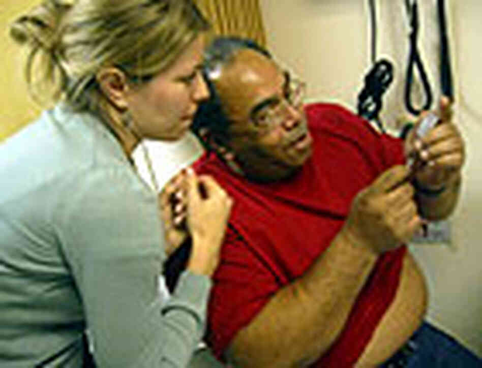 Dr. Jessie McCary helps Donald Cooper learn how to give himself an injection. Dr. Jessie McCary helps Donald Cooper learn how to give himself an injection.