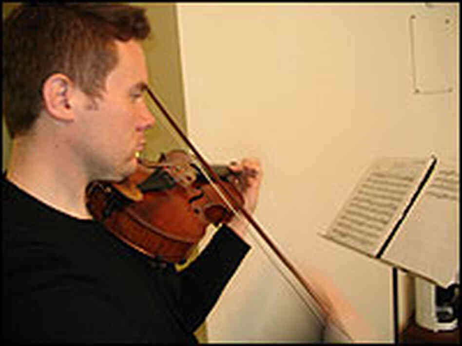 Doyle Armbrust practices on his viola. Doyle Armbrust practices on his viola.
