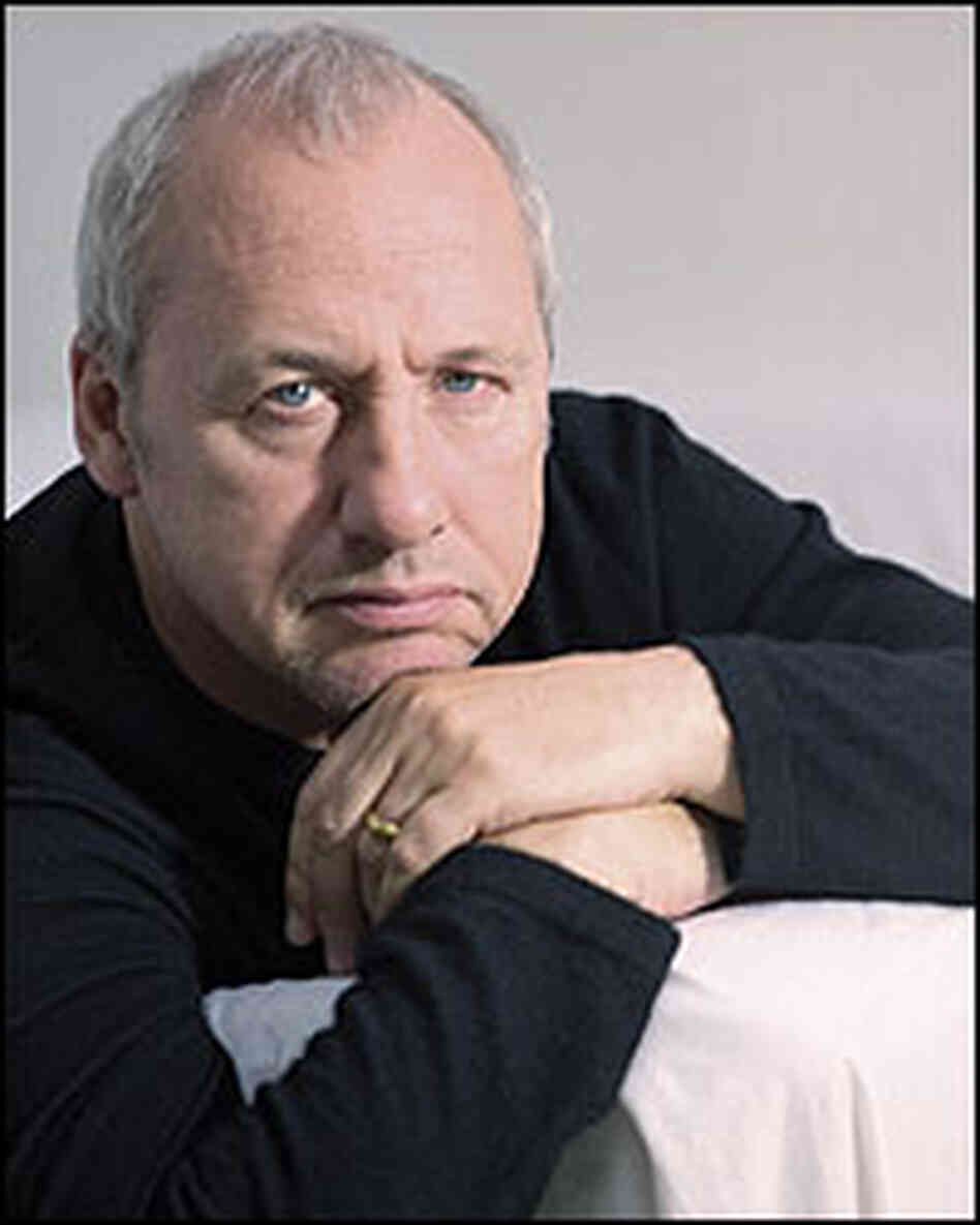 A portrait of Mark Knopfler shows his close-cropped gray hair. A portrait of Mark Knopfler shows his close-cropped gray hair.
