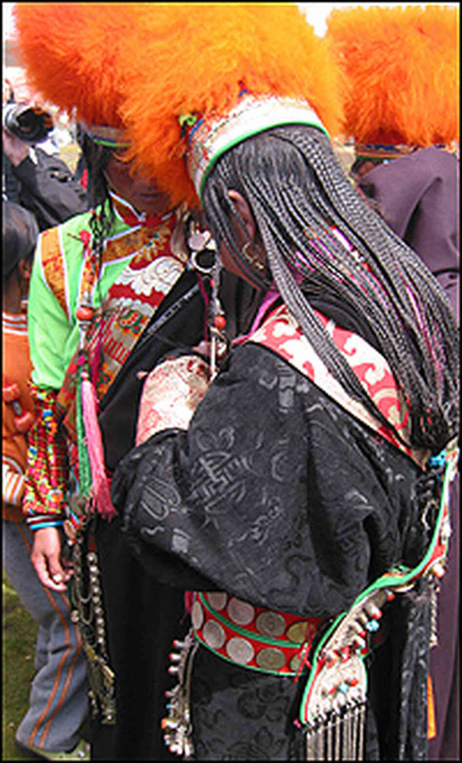 Khampa women dress up for the horse festival, braiding their hair into 108 strands.