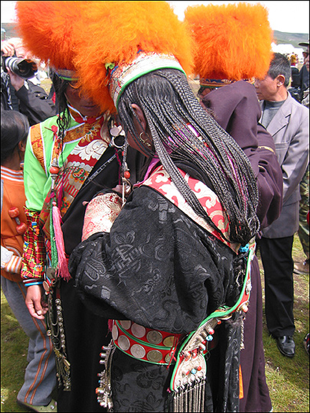 Khampa women dress up for the horse festival, braiding their hair into 108 strands.