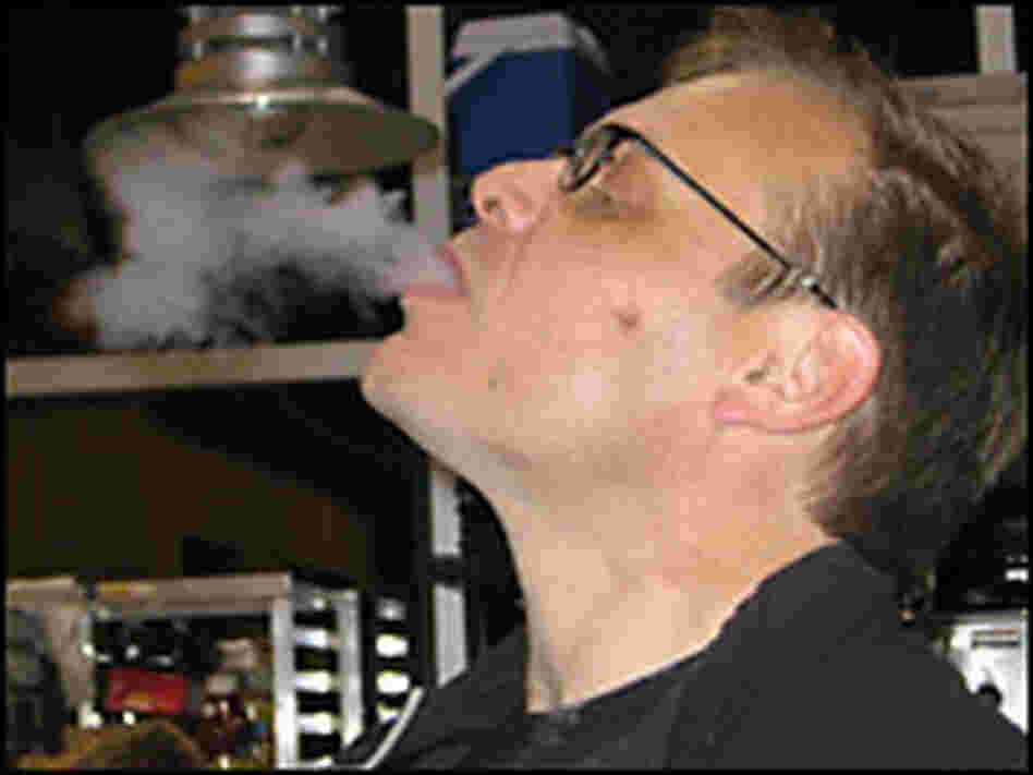 Culinary wizard Alton Brown exhales a breath of liquid nitrogen, used to freeze eggnog. Culinary wizard Alton Brown exhales a breath of liquid nitrogen, used to freeze eggnog.