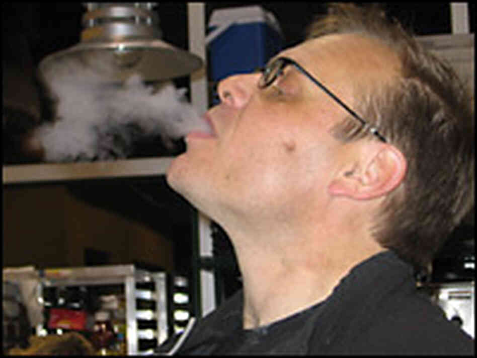 Culinary wizard Alton Brown exhales a breath of liquid nitrogen, used to freeze eggnog. Culinary wizard Alton Brown exhales a breath of liquid nitrogen, used to freeze eggnog.