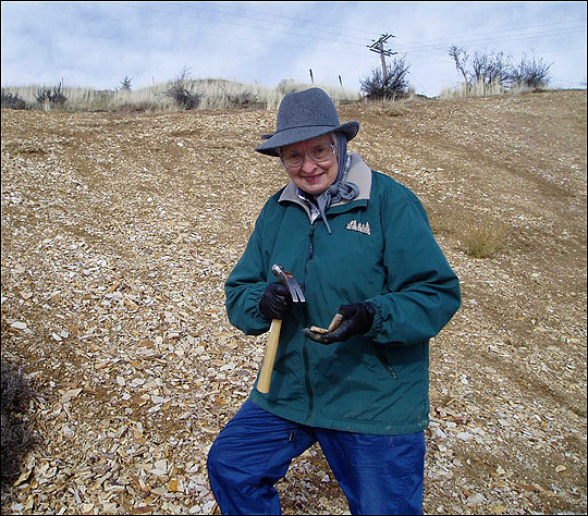 Karen Masshoff, with fossil digging tools.