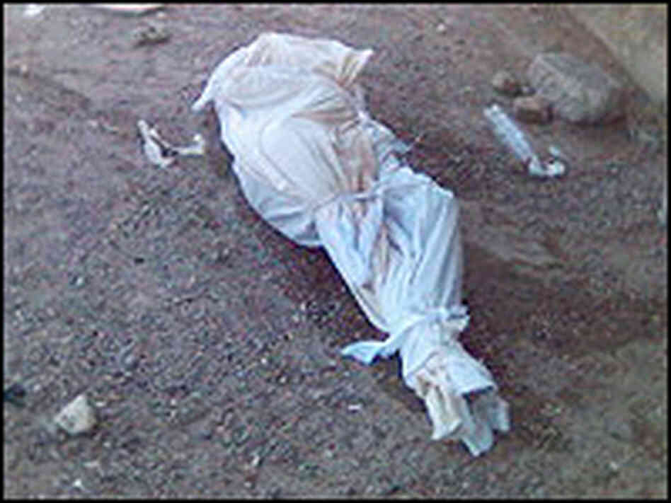 A body wrapped in a shroud. A body wrapped in a shroud.