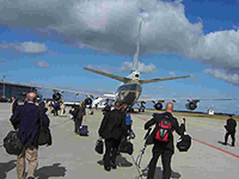 The White House press pool approaching Air Force One in Rostock, Germany.