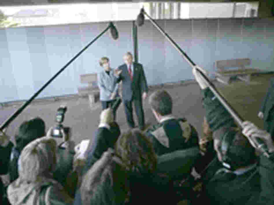 President Bush and Laura Bush meet with the press at Walter Reed Army Medical Center in 2004.