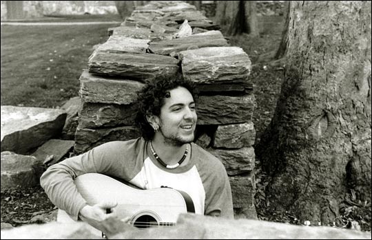 Nate Mott with his guitar.