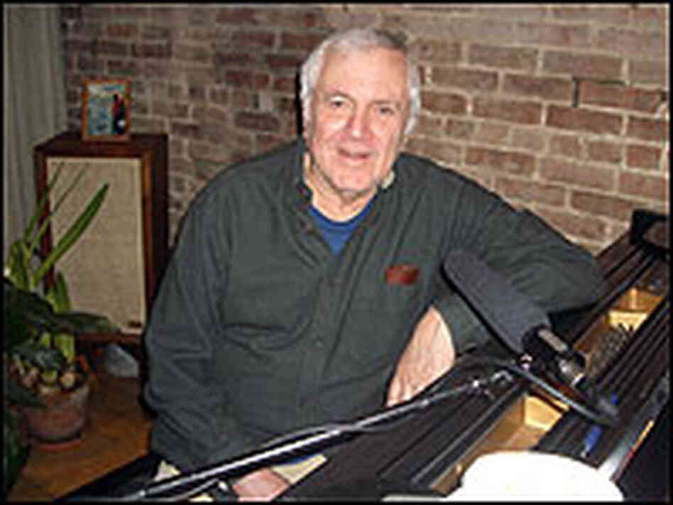 John Kander at his piano.