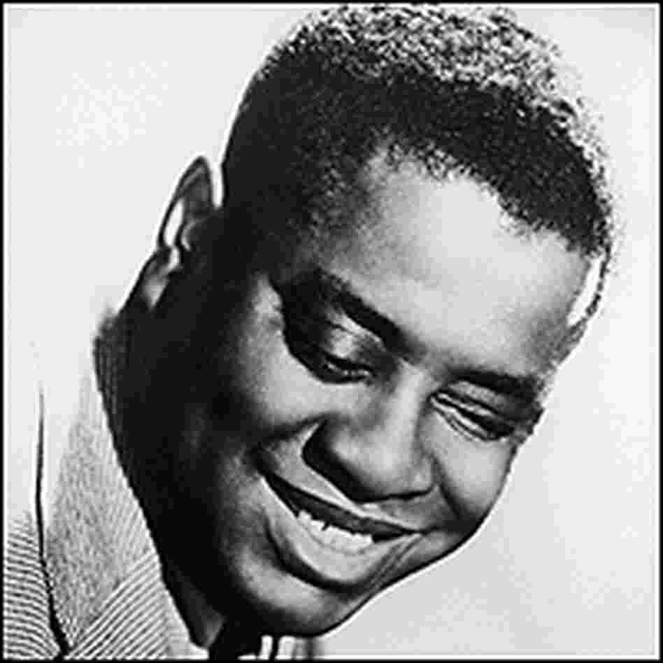 A closeup shot of a smiling Art Tatum.