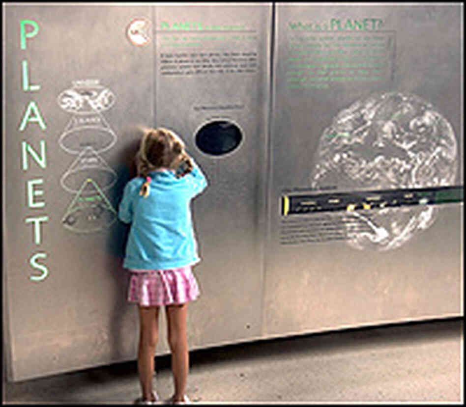A young visitor at the American Museum of Natural History's Cullman Hall of the Universe.