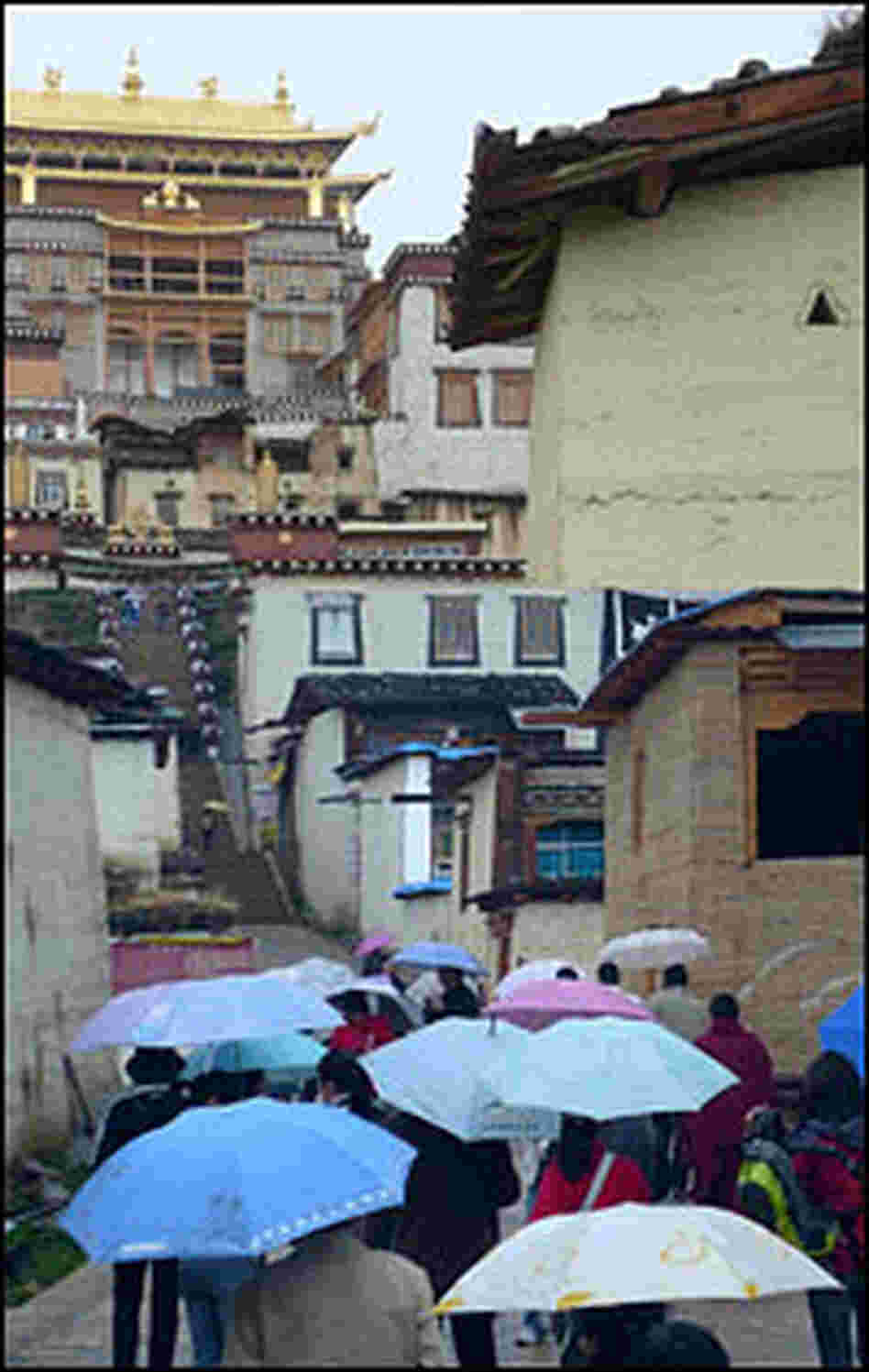 Tourists crowd up the steps of the 300-year-old Songzanling monastery. Tourists crowd up the steps of the 300-year-old Songzanling monastery.