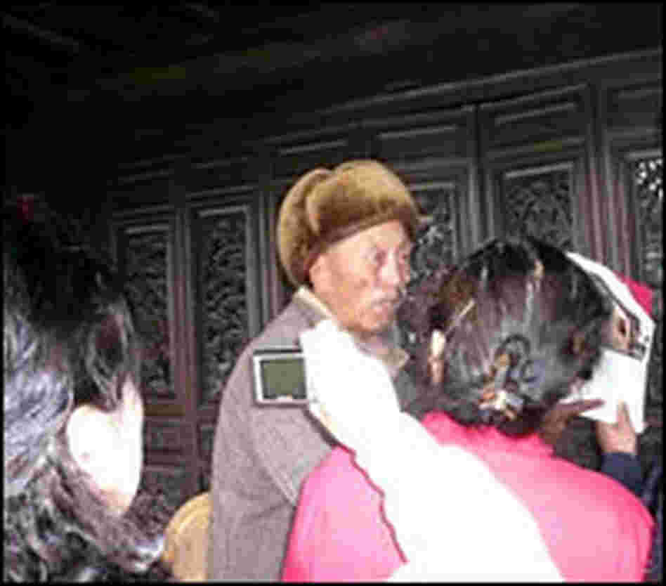 Abu Wangdui is besieged by visitors to his house.