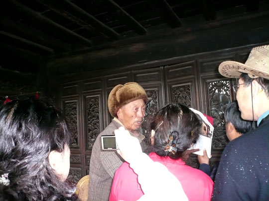 Abu Wangdui is besieged by visitors to his house.