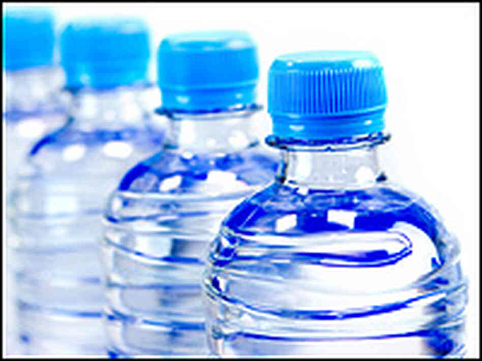 Bottled water in clear plastic bottles with bright-blue lids