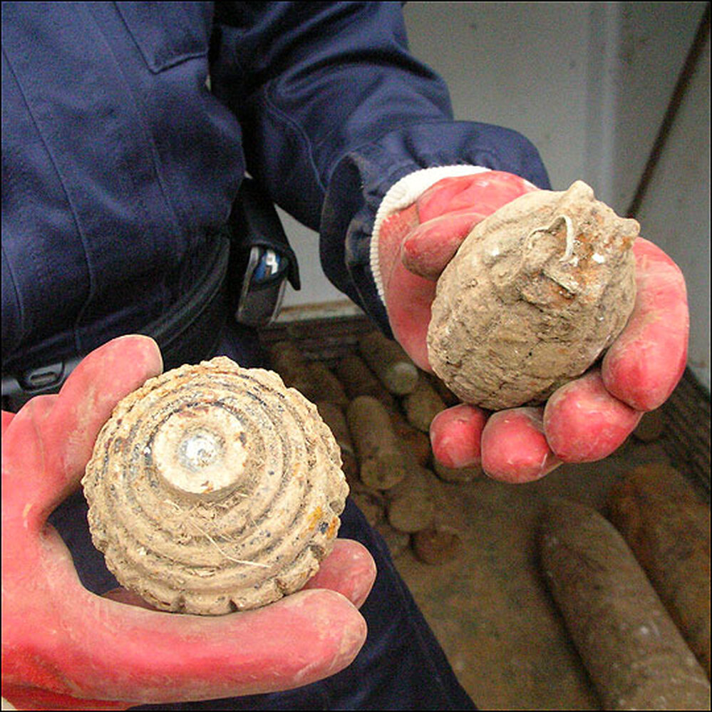 Unexploded grenades and shells found on a former WW1 battlefield in France.