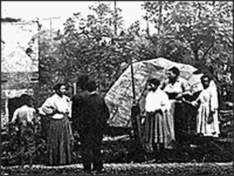 Black riot victims view the remains of their burned homes.