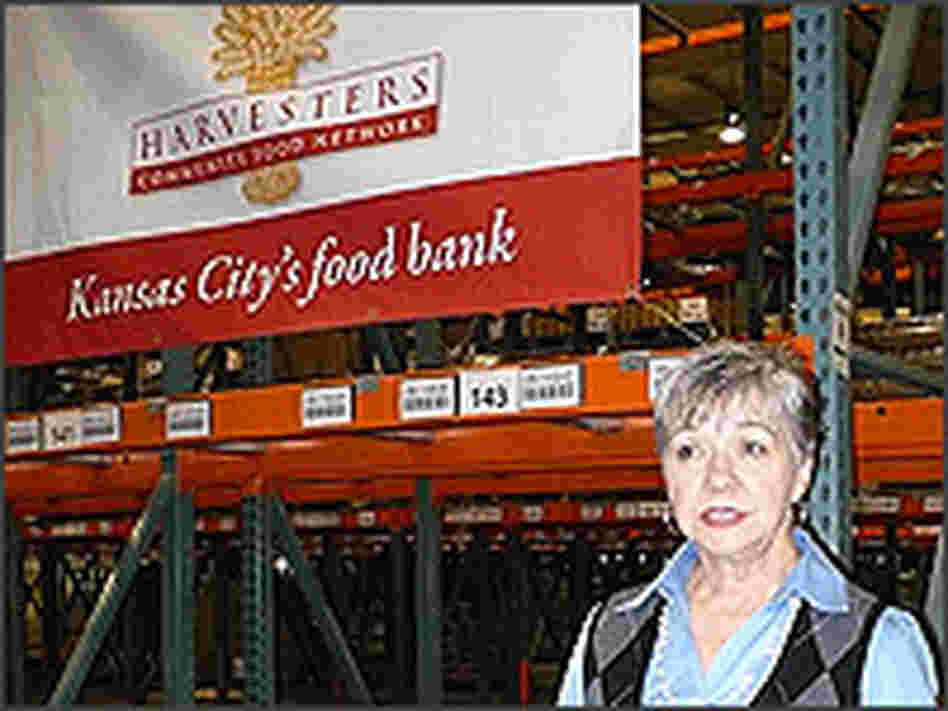 CEO Karen Haren stands in an empty warehouse run by Harvesters, a community food network.