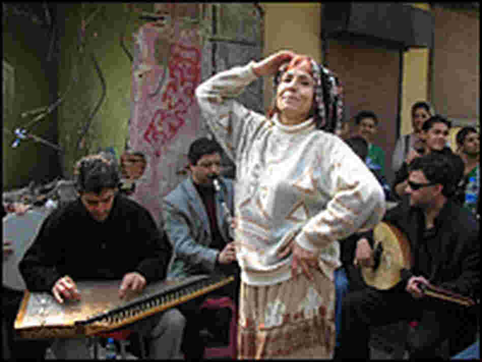 Romani musicians and a dancer. Peter Kenyon/NPR