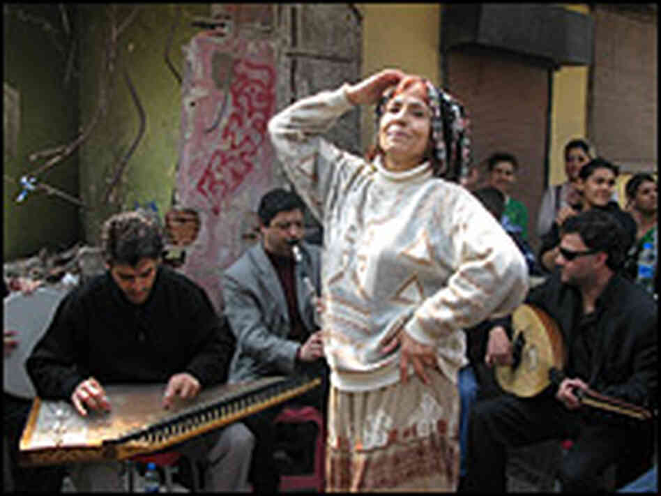 Romani musicians and a dancer. Peter Kenyon/NPR