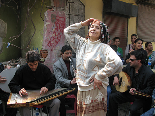 Romani musicians and a dancer. Peter Kenyon/NPR