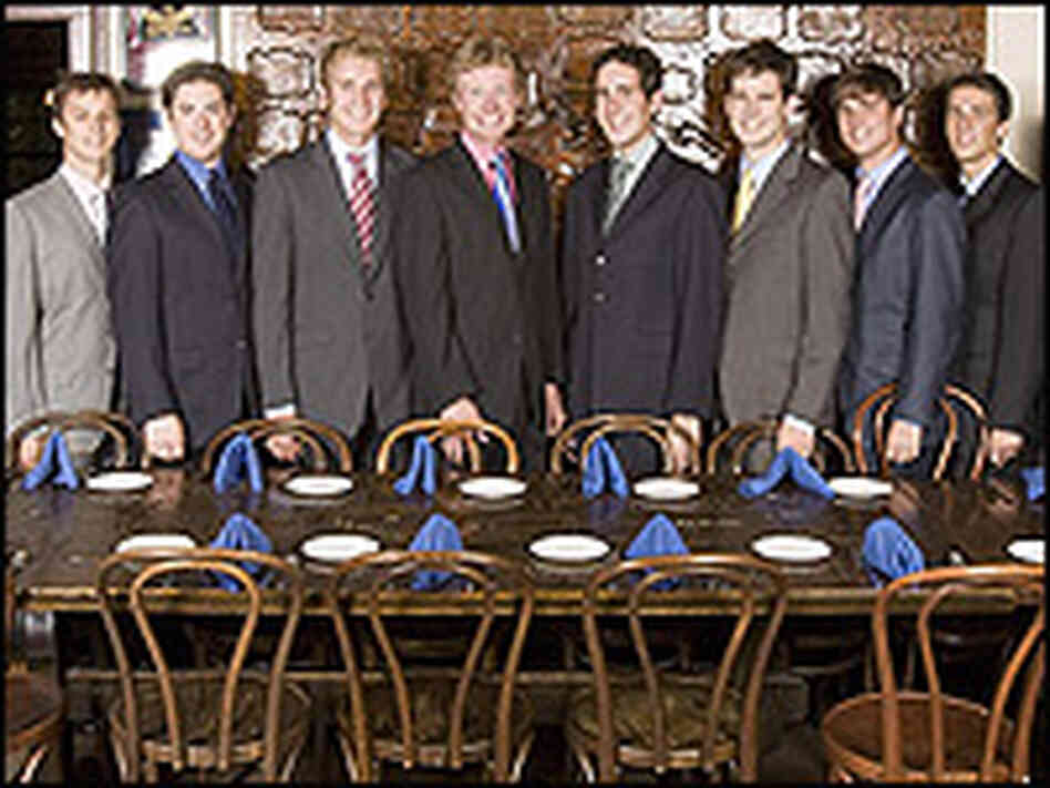 The Yale Whiffenpoofs of 2009 pose at the table they eat at every Monday night in Mory's Temple Bar.