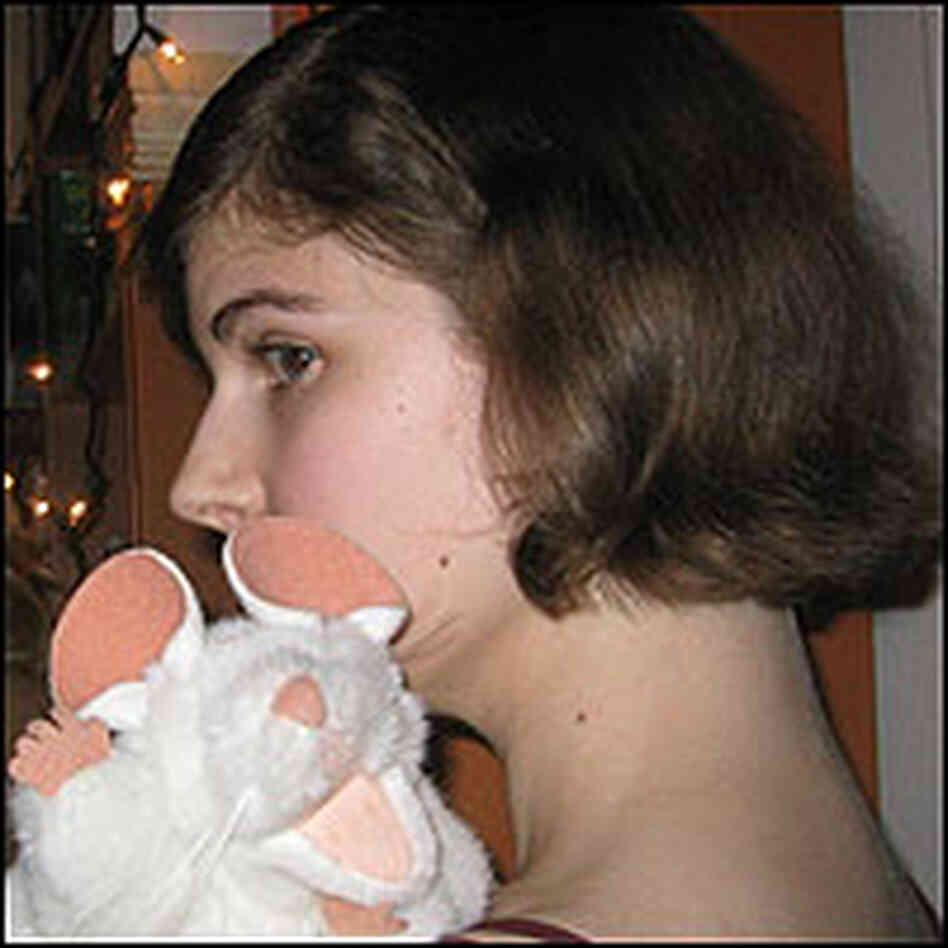 Librarian Elizabeth Bird, with a white stuffed mouse on her shoulder.