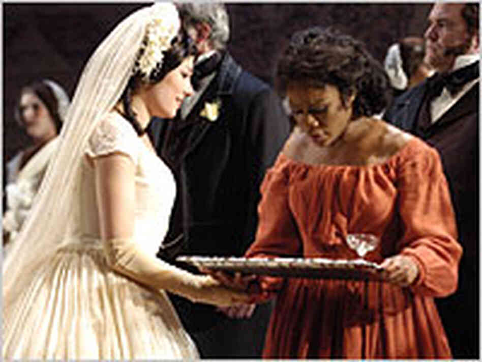 Margaret Garner (Denyce Graves) serves the guests at the wedding of Caroline (Inna Dukach) Margaret Garner (Denyce Graves) serves the guests at the wedding of Caroline (Inna Dukach)