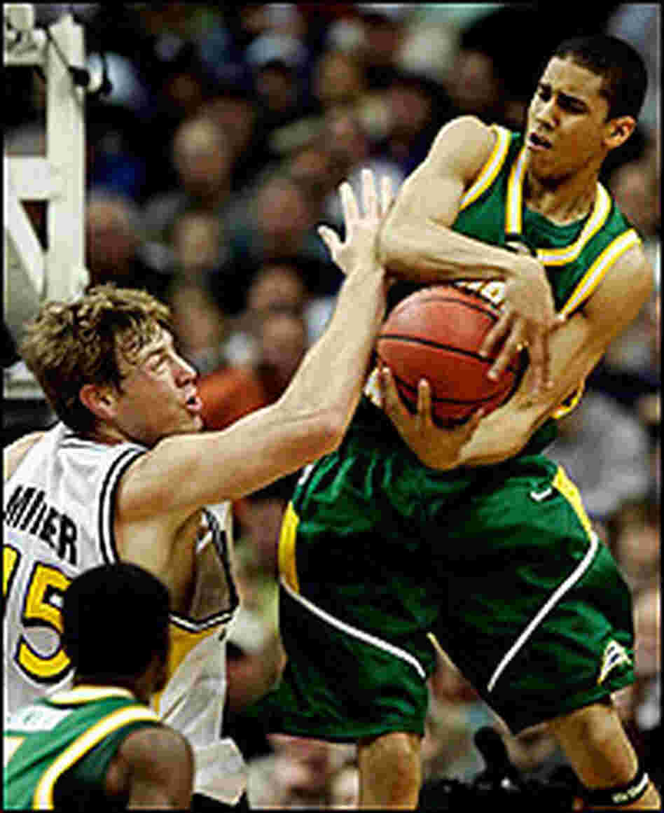 Gabe Norwood of George Mason grabs a rebound against Wichita State.