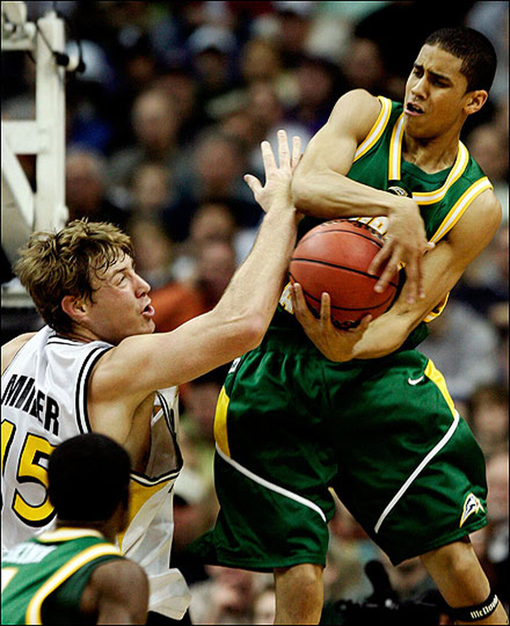 Gabe Norwood of George Mason grabs a rebound against Wichita State.