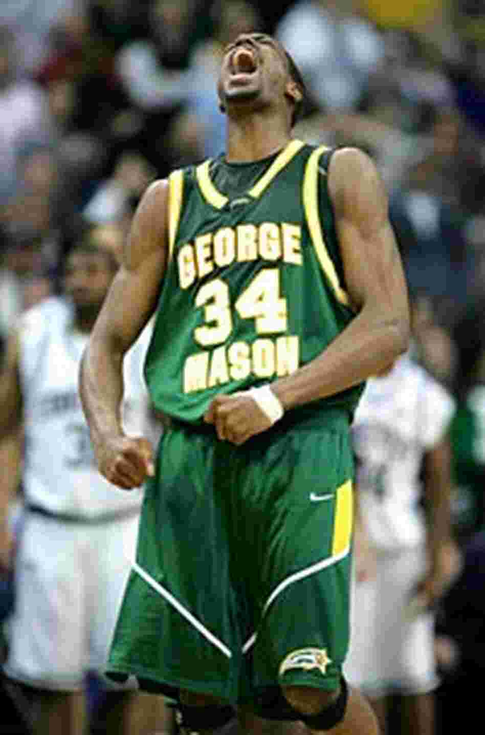 Will Thomas of George Mason exults after scoring a basket.