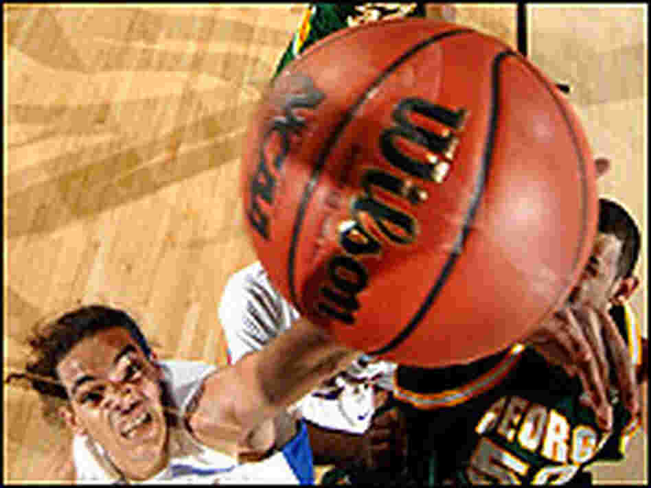 Joakim Noah of Florida reaches for a rebound as the ball comes off the rim.