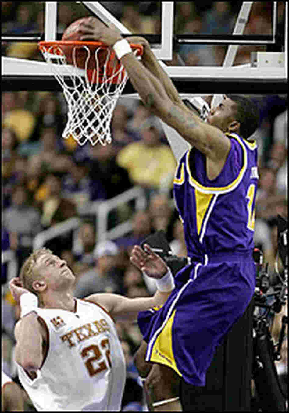 Tyrus Thomas of LSU dunks over Brad Buckman of Texas.
